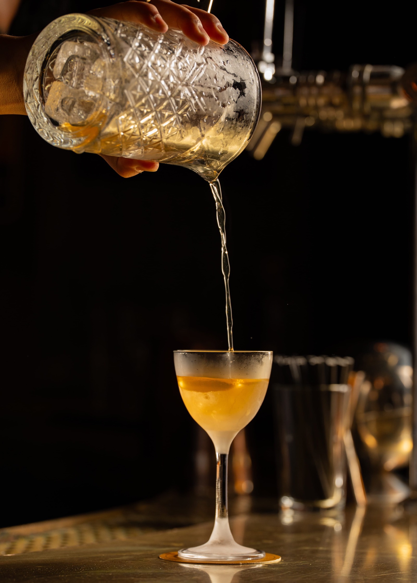 Cocktail poured into a Nick & Nora glass