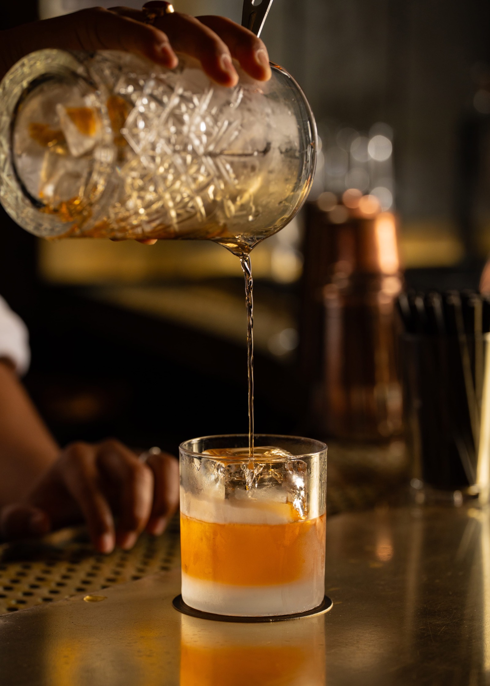 Old Fashioned cocktail being poured into a rocks glass at Employees Only Sydney